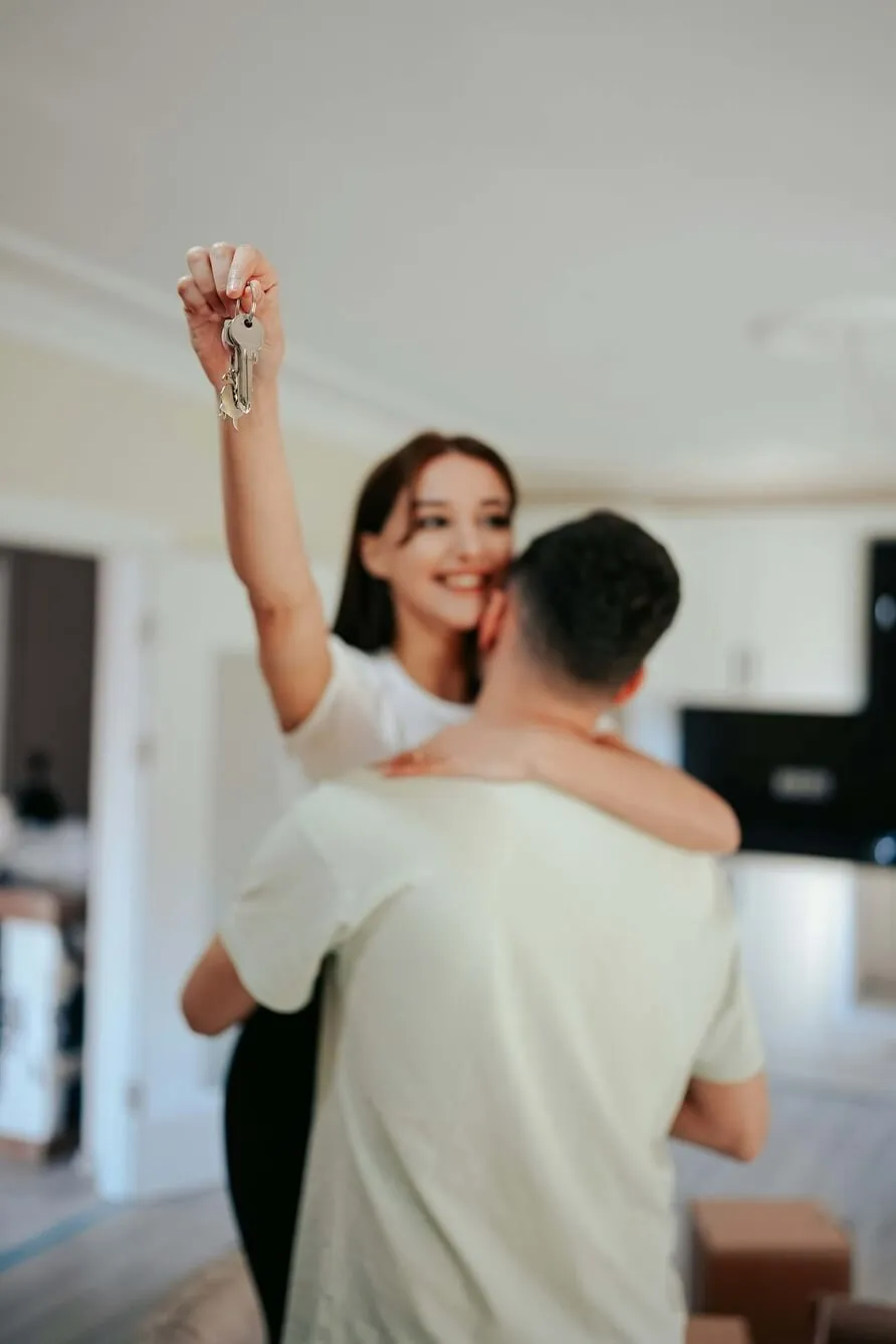 Picture of couple celebrating purchase of first home